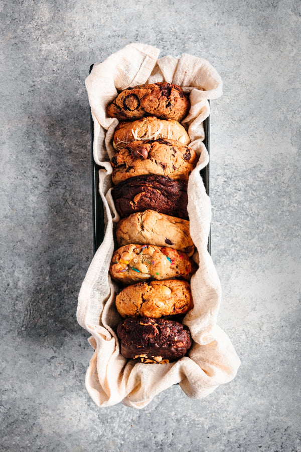 Selection of colossal cookies in luxury basket.